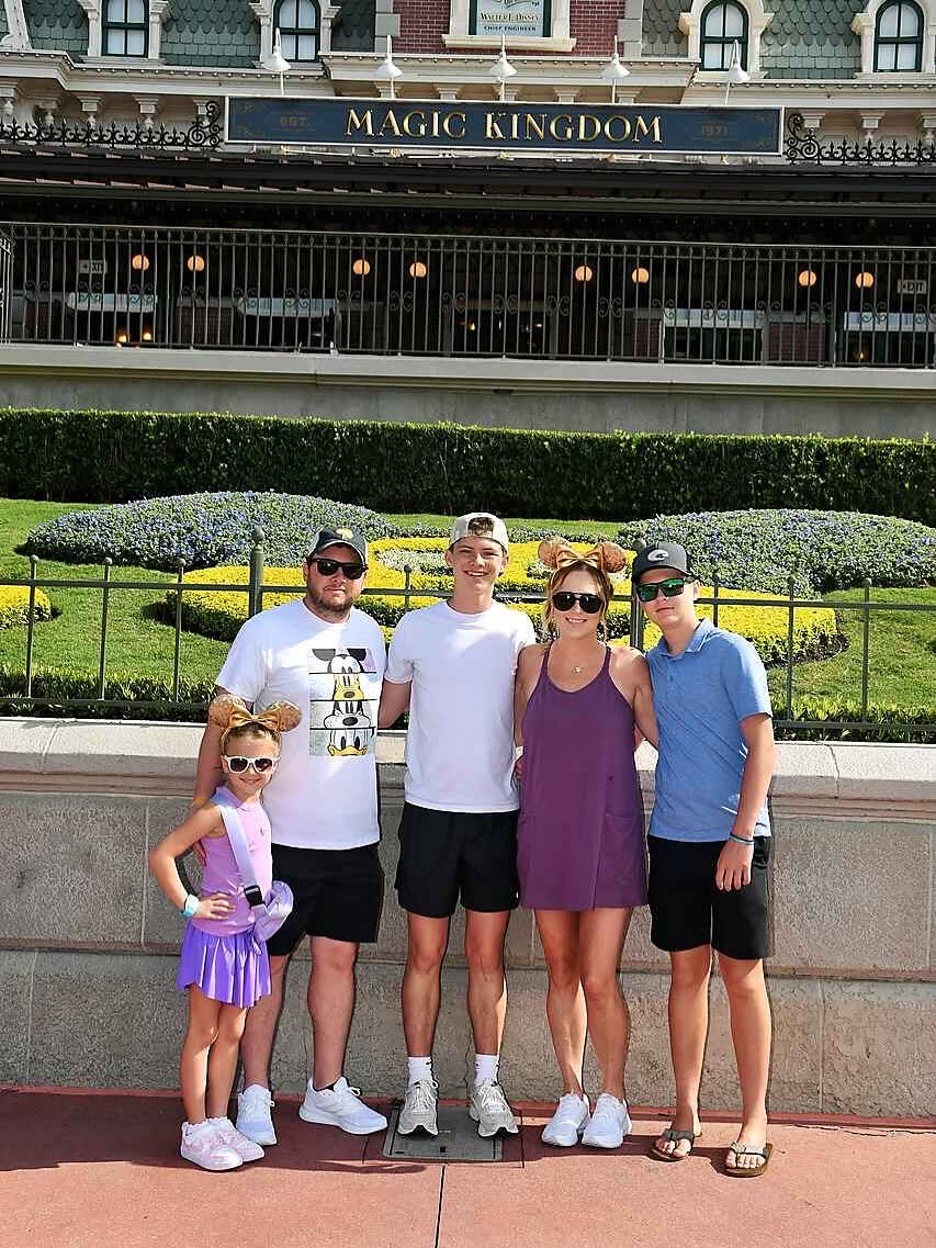 Justin Barrington with his family at Magic Kingdom